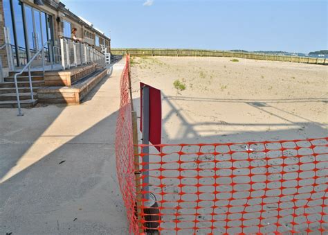 Opening South Boston beach delayed; boss away in England